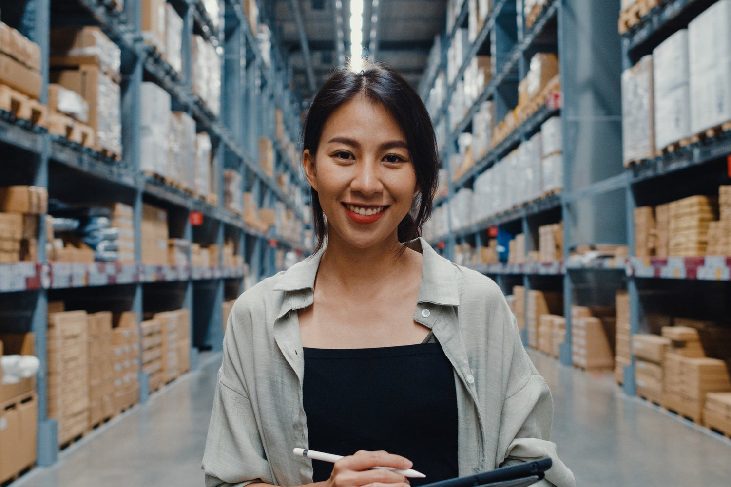 Happy woman in warehouse