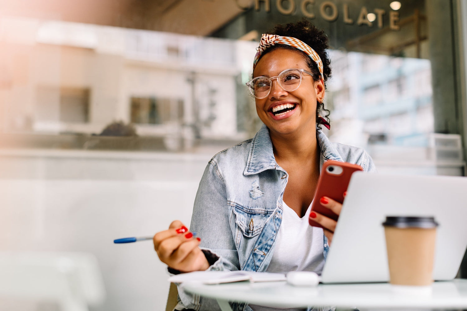 woman with glasses smiling